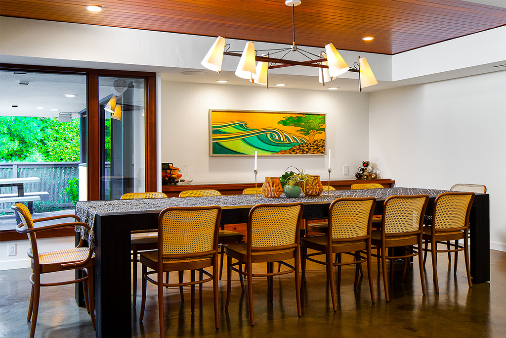 Dining room with large table and wooden accent ceiling